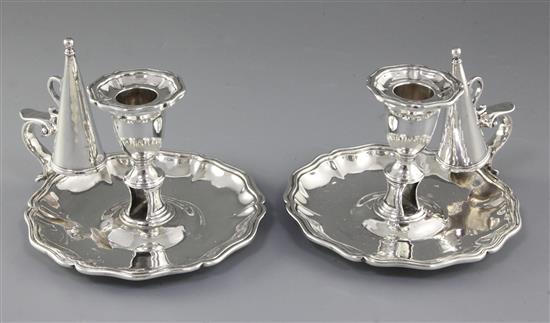 A pair of early Victorian silver chambersticks with conical snuffers, Height 4”/103mm Diameter 6”/155mm Combined weight 25.6oz/727gr